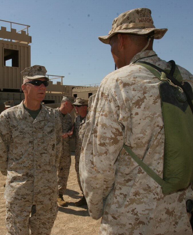 Several Marines take the opportunity to speak with the commandant inside of Range 200.  Marines gave feedback on the quality of training aboard the Combat Center.