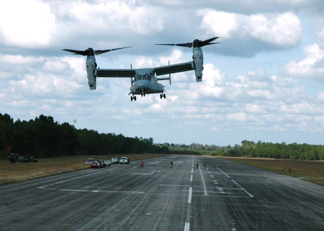 MARINE CORPS AIR STATION NEW RIVER, N.C. -- A Marine Corps MV-22 Osprey lifts off a runway here.  The MV-22 is a tilt-rotor aircraft.  When turned toward the sky, the two wing-mounted rotors on the craft allow for a vertical takeoff like a helicopter.  When turned forward, the craft flies as an airplane.  Air Force officials plan to purchase as many as 50 CV-22 aircraft.  (U.S. Air Force photo by Staff Sgt. C. Todd Lopez)