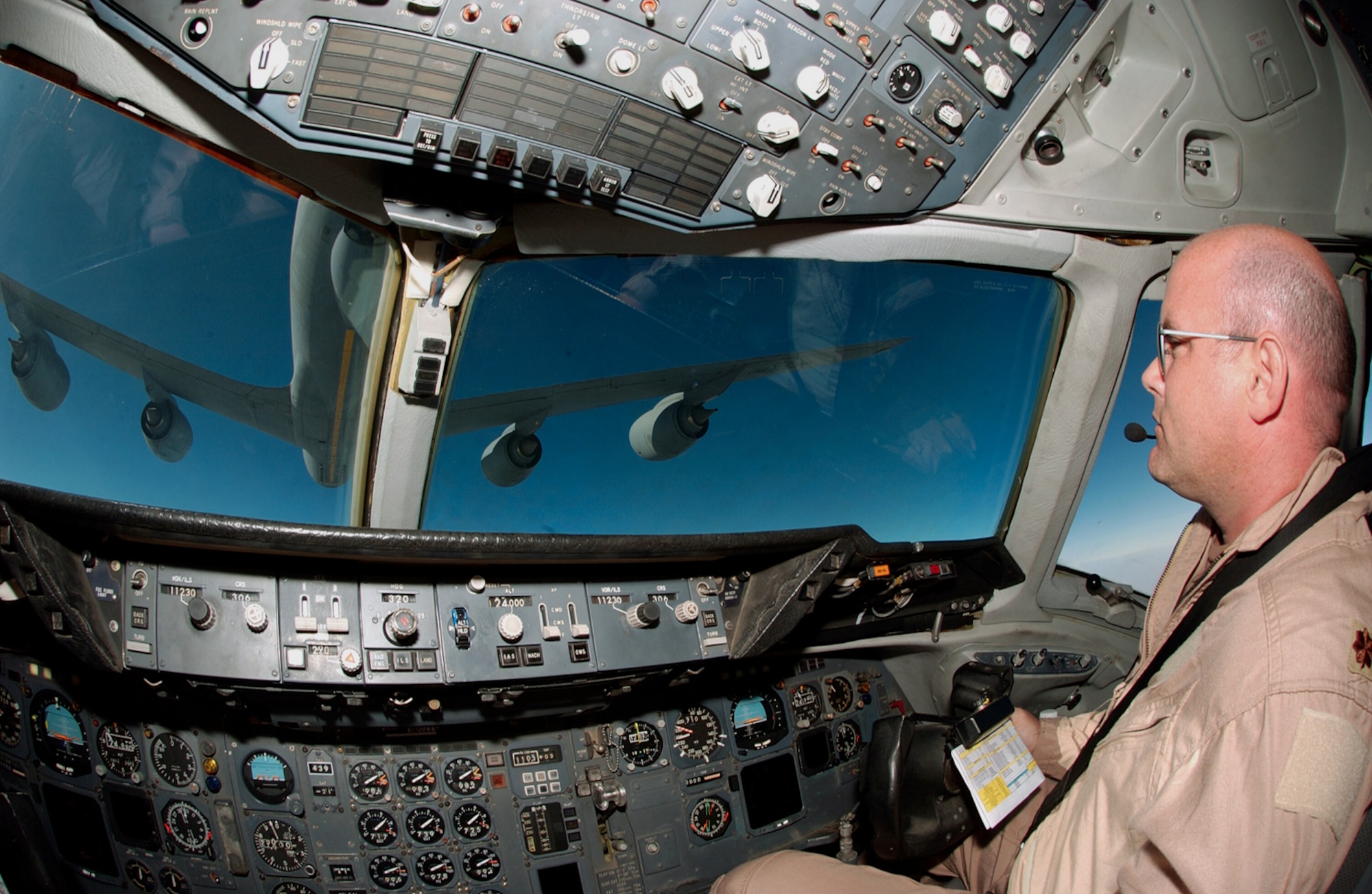 OVER SOUTHWEST ASIA -- Maj. Joe Burshnick positions his KC-10 Extender to receive fuel from a KC-135 Stratotanker.  Major Burshnick is a pilot with the 908th Expeditionary Aerial Refueling Squadron at a forward-deployed location.  The squadron is the only Air Force unit that flies both aircraft.  (U.S. Air Force photo by Tech. Sgt. Erik Gudmundson)              