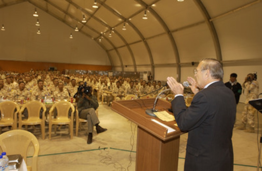 Secretary of Defense Donald H. Rumsfeld addresses Korean soldiers in Irbil, Iraq, on Oct. 10, 2004. Rumsfeld is in Iraq to show support for the coalition troops and meet with Iraqi officials. 