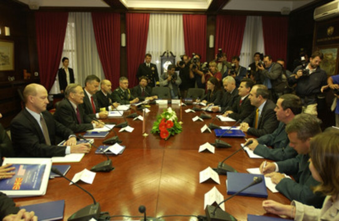 Secretary of Defense Donald H. Rumsfeld (2nd from left) and his senior advisors meet with Minister of Defense Vlado Buckovski and his staff on Oct 11, 2004, in Skopje, Macedonia. 