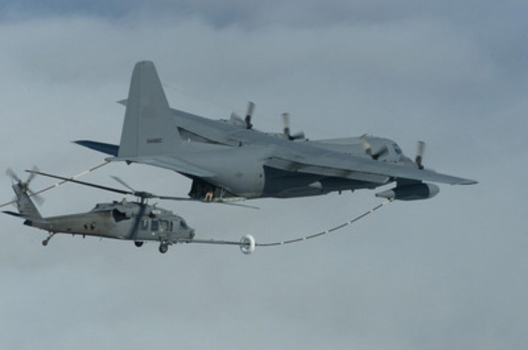 A U.S. Air Force HH-60 Pavehawk helicopter refuels in flight from a MC-130P Combat Shadow over the Pacific near San Diego, Calif., on Sept. 13, 2004. The refueling operation is part of water rescue training conducted jointly between the 55th, 79th, and 48th Rescue Squadrons, all part of the Air Force Search and Rescue Operations Squadron stationed at Davis-Monthan Air Force Base, Ariz. 