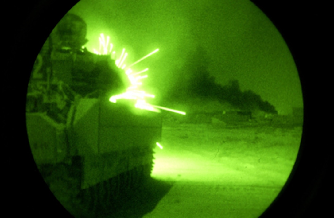 An Army Bradley Fighting Vehicle opens fire with its 25-millimeter machine gun on anti-coalition forces during Operation Baton Rouge in Samarra, Iraq, on Sept. 30, 2004. The soldiers from 1st Platoon, Bravo Troop, 1st Battalion, 4th Cavalry Regiment, 1st Infantry Division, first conducted assaults and then surrounded Samarra sealing it off to keep enemy forces from entering or leaving the town. 