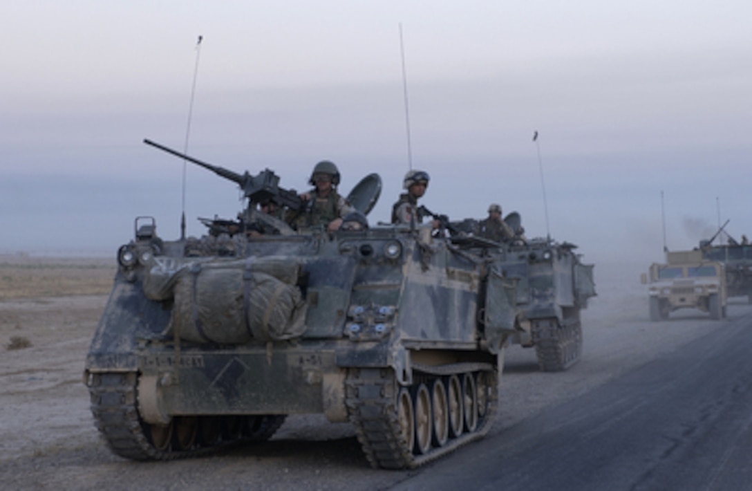 U.S. Army armored vehicles leave Samarra after conducting an assault during Operation Baton Rouge in Samarra, Iraq, on Oct. 1, 2004. Soldiers of the 1st Battalion, 4th Cavalry Regiment, 1st Infantry Division conducted the assault and then surrounded Samarra sealing it off to keep anti-coalition forces from entering or leaving the town. 