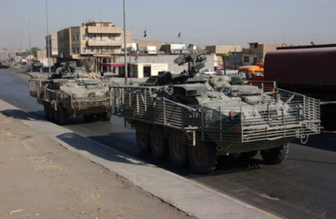 U.S. Army soldiers patrol in Stryker armored wheeled vehicles during a search for criminals and weapons as part of Operation Block Party in Mosul, Iraq, on Oct. 4, 2004. The soldiers are with the 1st Battalion, 14th Cavalry Regiment, 3rd Brigade, Stryker Brigade Combat Team, 2nd Infantry Division, from Fort Lewis, Wash. 