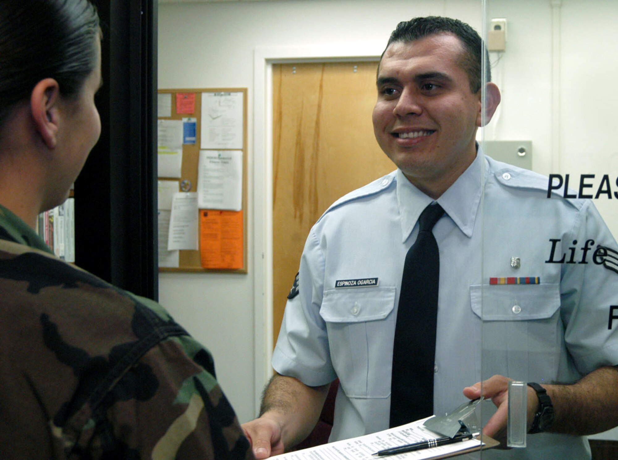COLUMBUS AIR FORCE BASE, Miss. -- Senior Airman Jesus Espinoza Ogarcia greets a patient at the life-skills support center here.  He is a mental-health technician with the 14th Medical Operations Squadron.  (U.S. Air Force photo by Airman 1st Class Cecilia Rodriguez)