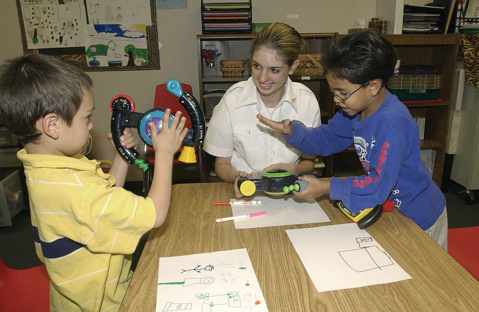 NELLIS AIR FORCE BASE, Nev. -- Jennifer Rooney, a babysitter club member, stops by the youth center here at the end of her school day to visit with the children and assist instructors.  (U.S. Air Force photo by Staff Sgt. Darryl Barnes)