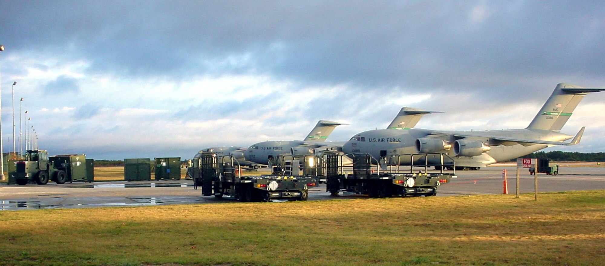 ALPENA, Mich. -- C-17 Globemaster IIIs from the 62nd Airlift Wing at McChord Air Force Base, Wash., are parked on the flightline here at the Combat Readiness Training Center flight operations area.  The C-17s are at a Michigan Air National Guard base supporting exercise Crisis Look 2004.  (U.S. Air Force photo by Staff Sgt. Scott T. Sturkol)