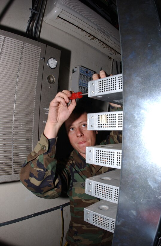 CAMP BUTMIR, Bosnia-Herzegovina -- Staff Sgt. Ian V. Huntley begins the process of removing a digital line of sight unit from a communications tower near here.  Sergeant Huntley is assigned to the NATO Stabilization Forces.  (U.S. Air Force photo by Tech. Sgt. Thomas F. Fischer)