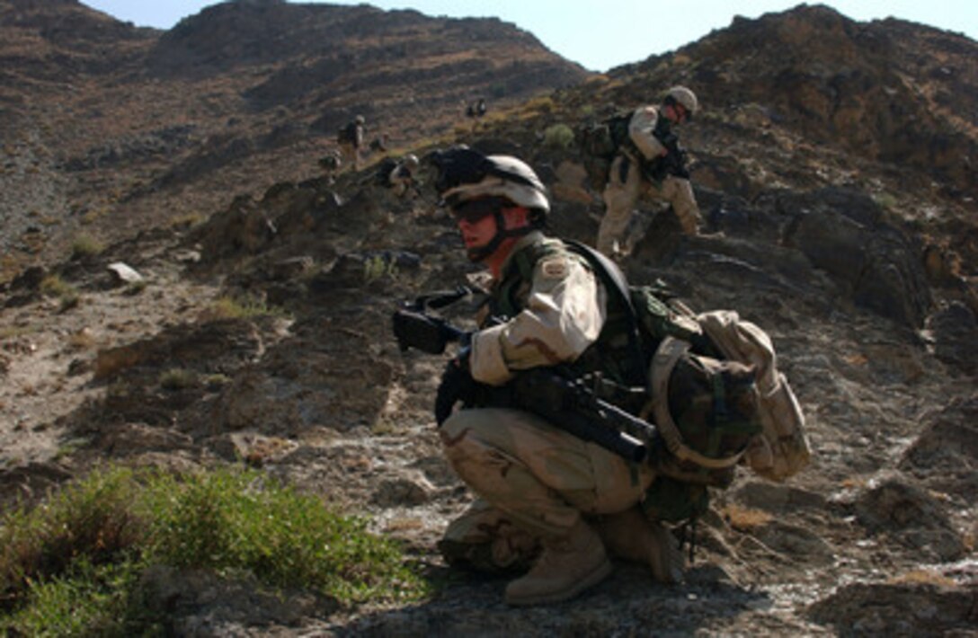 A U.S. Army soldier brings up the rear while on a dismounted patrol high in the mountains of Nowabab, Afghanistan, on Oct. 7, 2004. The soldiers are assigned to B Company, 1st Battalion, 505th Parachute Infantry Regiment. 