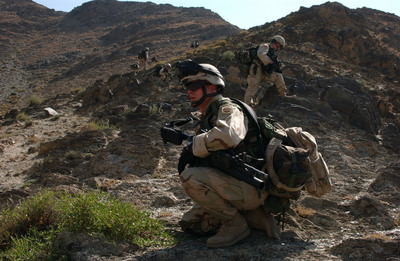 A U.S. Army soldier brings up the rear while on a dismounted patrol.