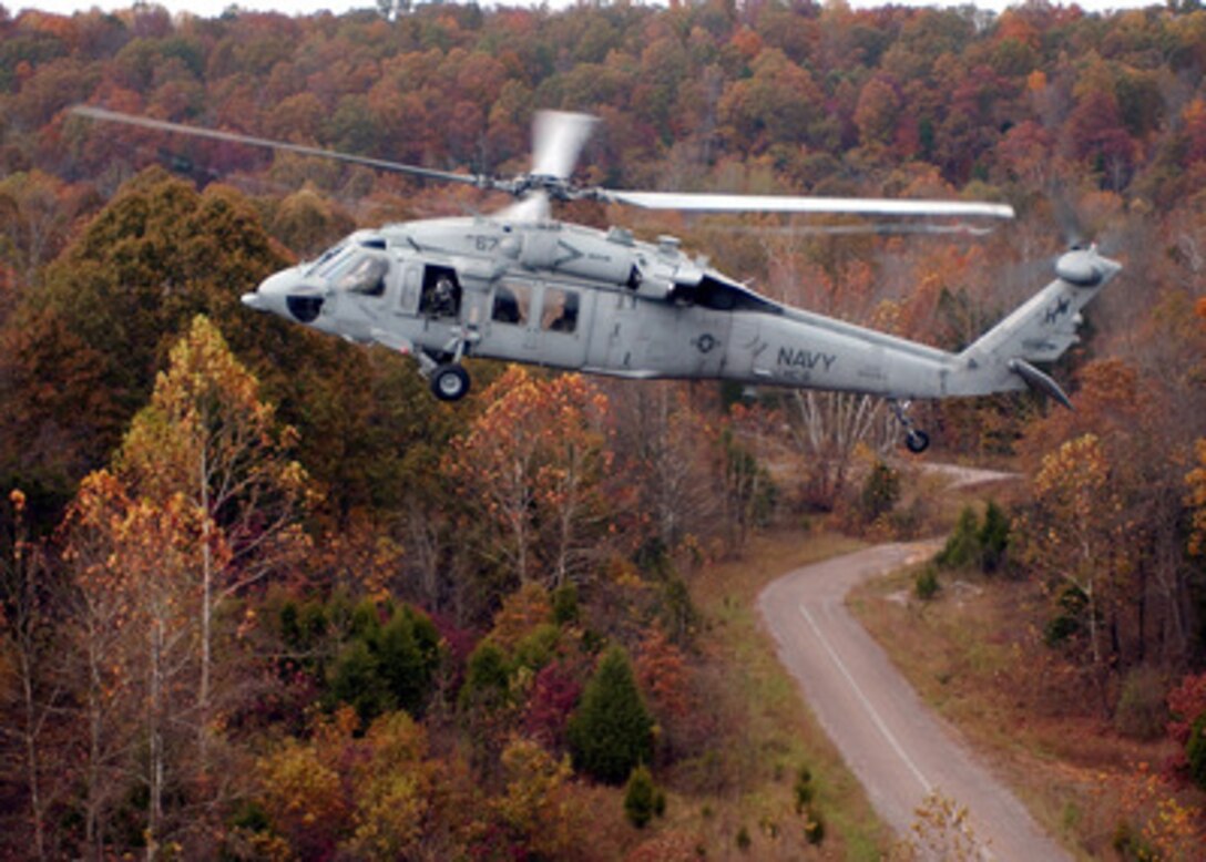 An MH-60S Knighthawk helicopter flies over Fort Knox, Ky., on Oct. 20, 2004. The Navy helicopter is assigned to Helicopter Combat Support Squadron 6 and is conducting combat search and rescue operation training exercises in the Fort Knox area. 