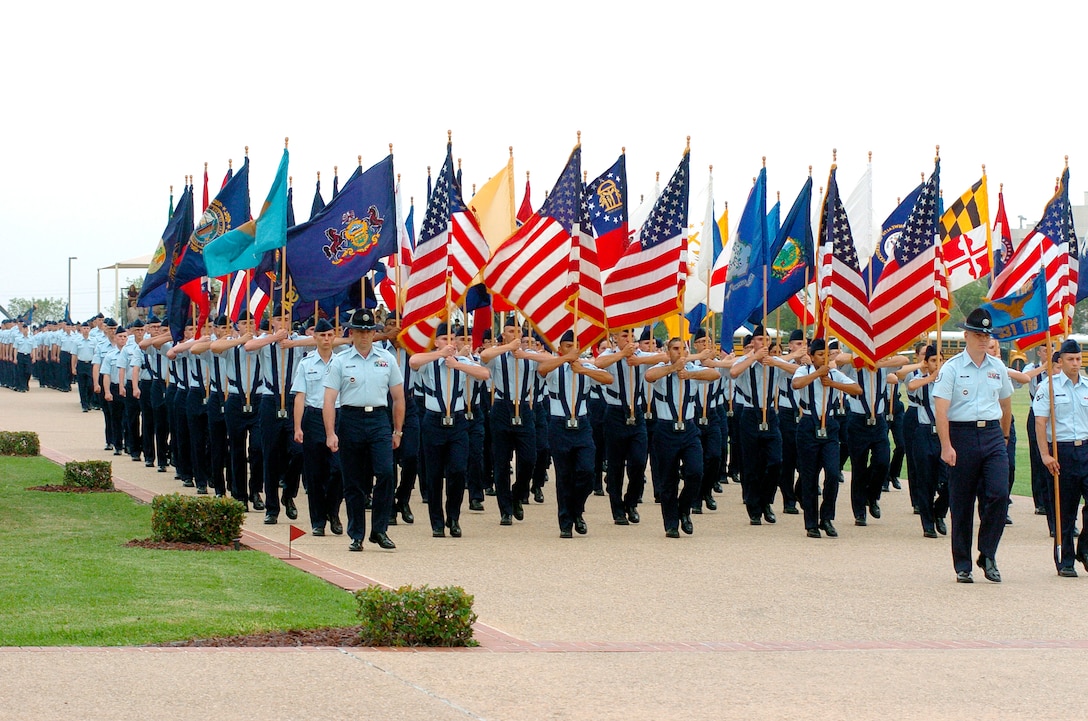 LACKLAND AIR FORCE BASE, Texas -- Airmen carry state flags during Basic Military Training graduation here Oct. 22.  The ceremonies were attended by Secretary of the Air Force Dr. James G. Roche and Air Force Chief of Staff Gen. John P. Jumper.  (U.S. Air Force photo by Master Sgt. Jack Braden)
