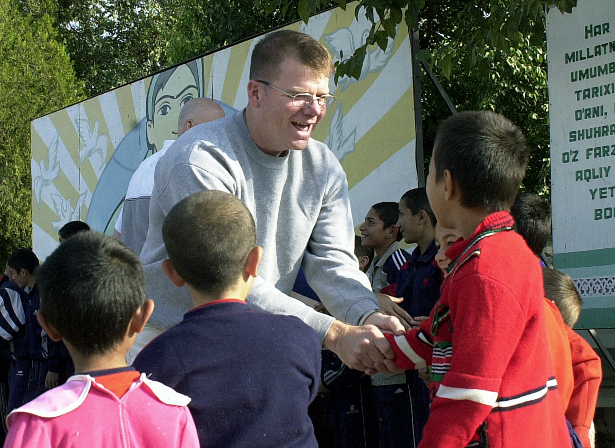 KARSHI, Uzbekistan -- Chief Master Sgt. Chuck Nail arrives at a children's home here.  Chief Nail was one of a dozen Airmen and Soldiers who visited the school, bringing school supplies, clothes and toys for the children.  He is assigned to the 416th Air Expeditionary Group at nearby Karshi-Khanabad.  (U.S. Air Force photo by Senior Airman Matthew Rosine)