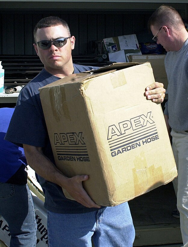 KARSHI-KHANABAD AIR BASE, Uzbekistan -- Staff Sgt. Jason Morris helps load school supplies and gifts for a local Uzbekistan children's home here.  He is assigned to the 416th Air Expeditionary Group here.  (U.S. Air Force photo by Senior Airman Matthew Rosine)
