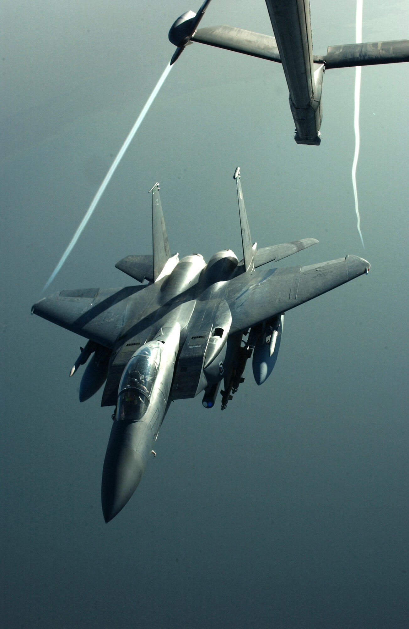 OVER IRAQ -- An F-15E Strike Eagle flies off in the early evening light after receiving fuel from a 908th Expeditionary Air Refueling Squadron KC-10 Extender during a recent mission here in support of Operation Iraqi Freedom.  (U.S. Air Force photo by Tech. Sgt. Erik Gudmundson)