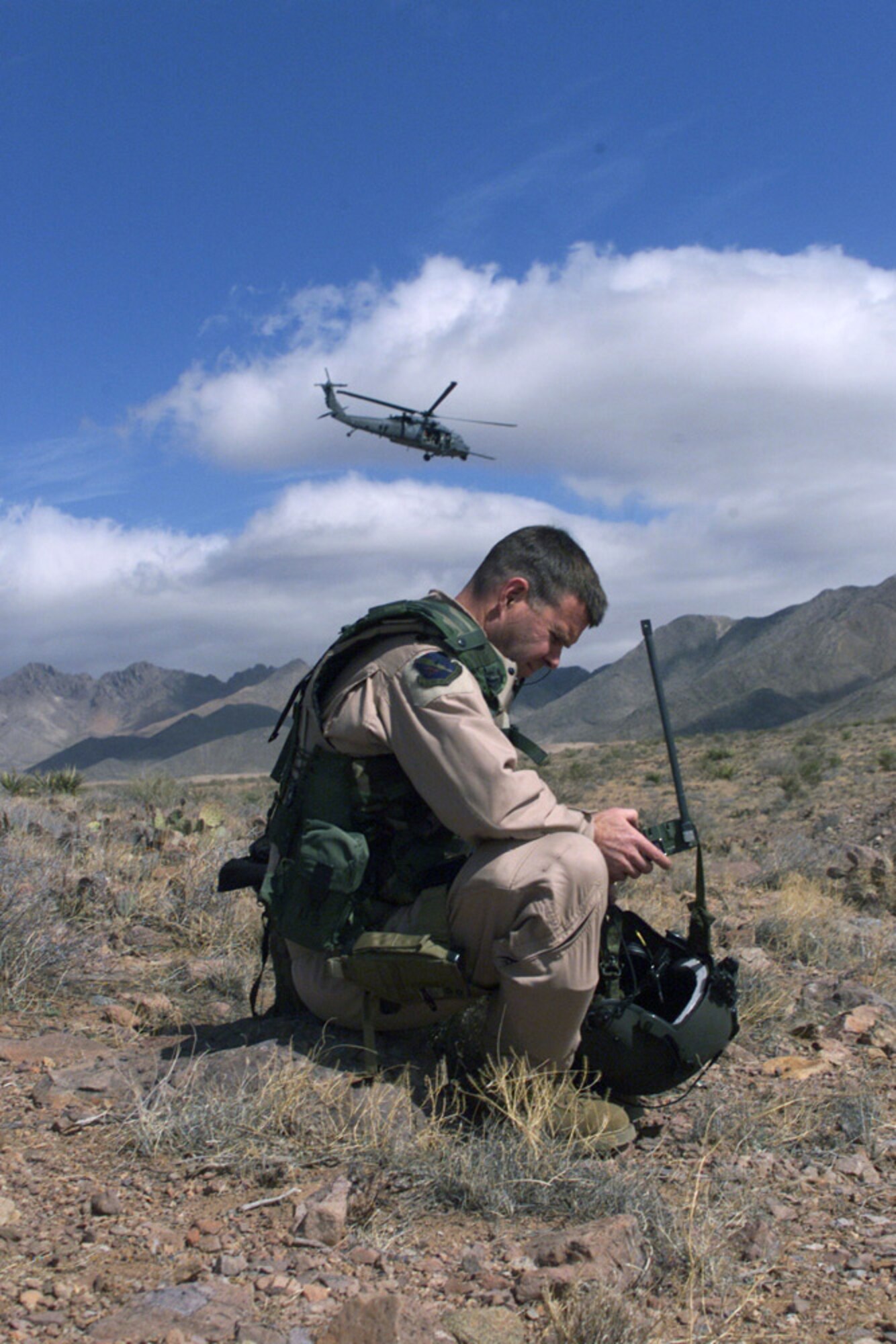 FORT BLISS, Texas -- An HH-60 Pave Hawk from the 55th Rescue Squadron circles overhead searching for a "survivor" during a combat search and rescue exercise at Biggs Army Air Field here.  (U.S. Air Force photo by 1st Lt. Rebecca Garland)