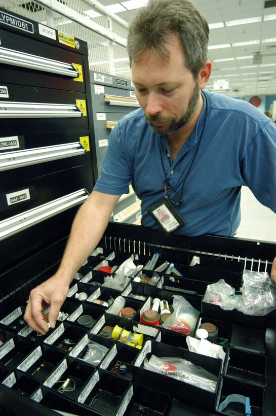 ROBINS AIR FORCE BASE, Ga. -- Robert Foster gets a part from bench stock.  He is an electronics technician assigned to the maintenance directorate here.  (U.S. Air Force photo by Sue Sapp)