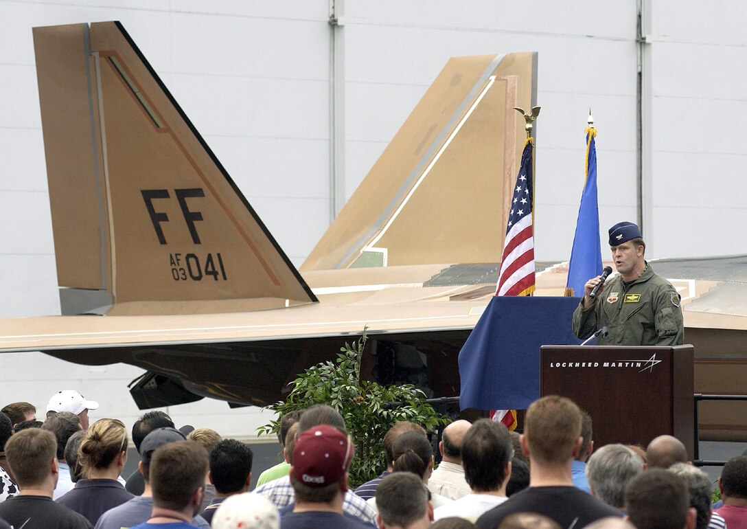 MARIETTA, Ga. -- Col. Frank Gorenc addresses the crowd at Lockheed Martin's F/A-22 Raptor factory here Oct. 27.  He and other members of the 1st Fighter wing at Langley Air Force Base, Va., were here for the roll-out of wing's first operational Raptor.  The aircraft will now undergo a modification process before arriving at the base in May.  Colonel Gorenc is the 1st FW commander.  (Photo courtesy of Lockheed Martin)