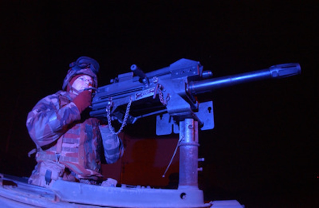 Senior Airman Misty Brown, U.S. Air Force, keeps a sharp eye out for opposition forces from the gun turret of a Humvee during exercise Beverly Bulldog 04-04 at Kunsan Air Base, South Korea, on Oct. 28, 2004. Brown is assigned to the 8th Security Forces. 
