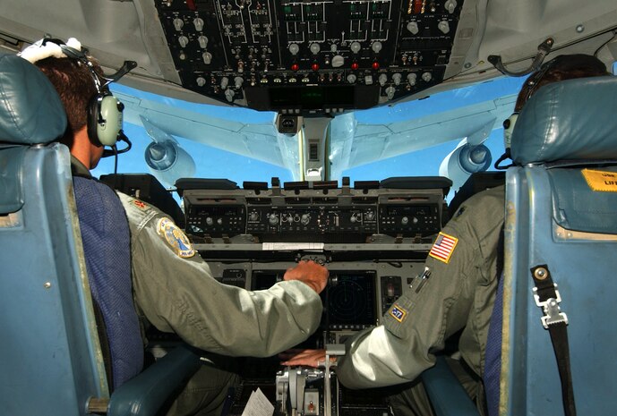 OVER THE EAST COAST -- Lt. Col. Tom Clayton and Maj. Dave Deames line up a C-17 Globemaster to refuel with a KC-135 Stratotaker from the Ohio Air National Guard’s 121st Air Refueling Wing.  The aircrew is assigned to the 300th Air Lift Squadron at Charleston Air Force Base, S.C.  (U.S. Air Force photo by Staff Sgt. Suzanne M. Jenkins)  