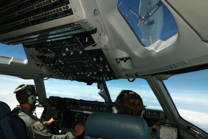 OVER THE EAST COAST -- Lt. Col. Tom Clayton and Maj. Dave Deames line up a C-17 Globemaster to refuel with a KC-135 Stratotaker from the Ohio Air National Guard’s 121st Air Refueling Wing.  The aircrew is assigned to the 300th Air Lift Squadron at Charleston Air Force Base, S.C.  (U.S. Air Force photo by Staff Sgt. Suzanne M. Jenkins)  

