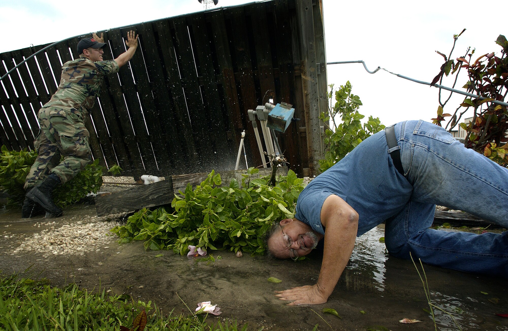 PATRICK AIR FORCE BASE, Fla. -- Phil Hyde helps shut off a broken waterline Sept. 6 during recovery operations here.  The waterline broke as a result of Hurricane Frances, which hit the base and the surrounding community.  Mr. Hyde is a plumber with the 45th Civil Engineer Squadron.  (U.S. Air Force photo by Master Sgt. Efrain Gonzalez)