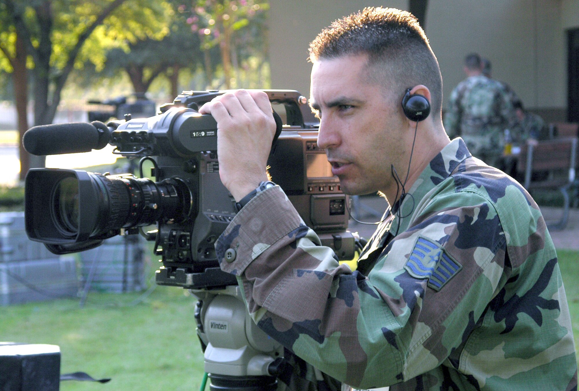 SAN ANTONIO - Tech. Sgt. Brady McCarron tapes a mock holiday greeting during a training session here.  Four teams from Army and Air Force Hometown News Service will soon travel to about 70 overseas installations in 40 days to tape Airmen, Soldiers, Sailors, Marines and Department of Defense civilians who want to send holiday messages home.  Sergeant McCarron is a broadcaster with the hometown news service.  (U.S. Air Force photo by Master Sgt. Jack Braden)