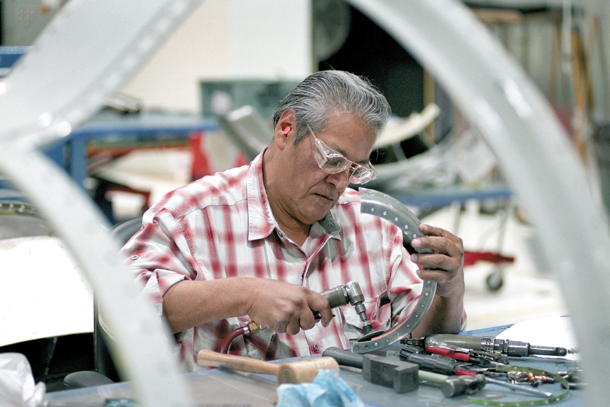 TINKER AIR FORCE BASE, Okla. -- In 1950, Steve Espinoza became a member of the Air Force family.  More than 50 years later, he still serves the Air Force as a sheet-metal mechanic for the Oklahoma City Air Logistics Center here.  (U.S. Air Force photo by Margo Wright)