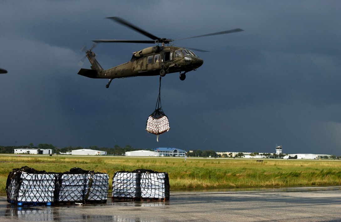 LAKELAND, Fla. -- A UH-60 Blackhawk from the Alabama National Guard returns to Lakeland Linder Airport after being diverted by an ominous summer storm here Sept. 9.  The Blackhawks have been transporting supplies to areas of Florida affected by Hurricane Frances.  (U.S. Air Force photo by Staff Sgt. Shelley Gill) 