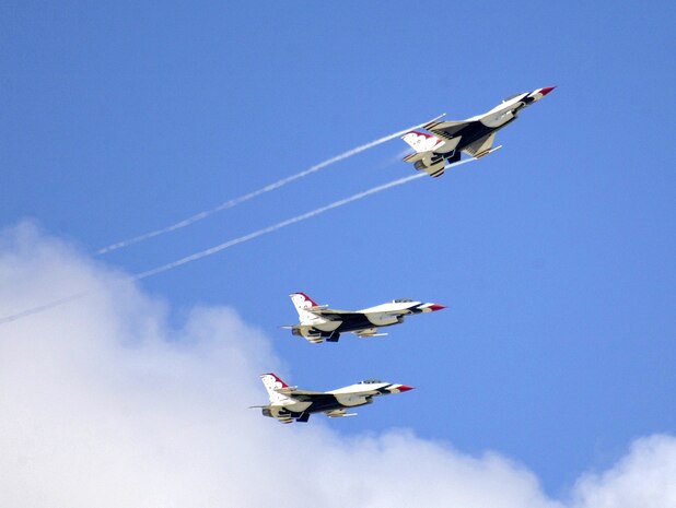ANDERSEN AIR FORCE BASE, Guam -- Thunderbird pilots prepare to land here Sept. 9.  Airmen from the U.S. Air Force Air Demonstration Squadron recently spent five months turning a gray combat-ready F-16 Fighting Falcon into a red, white and blue team aircraft.  (U.S. Air Force photo by Staff Sgt. Bennie J. Davis III)