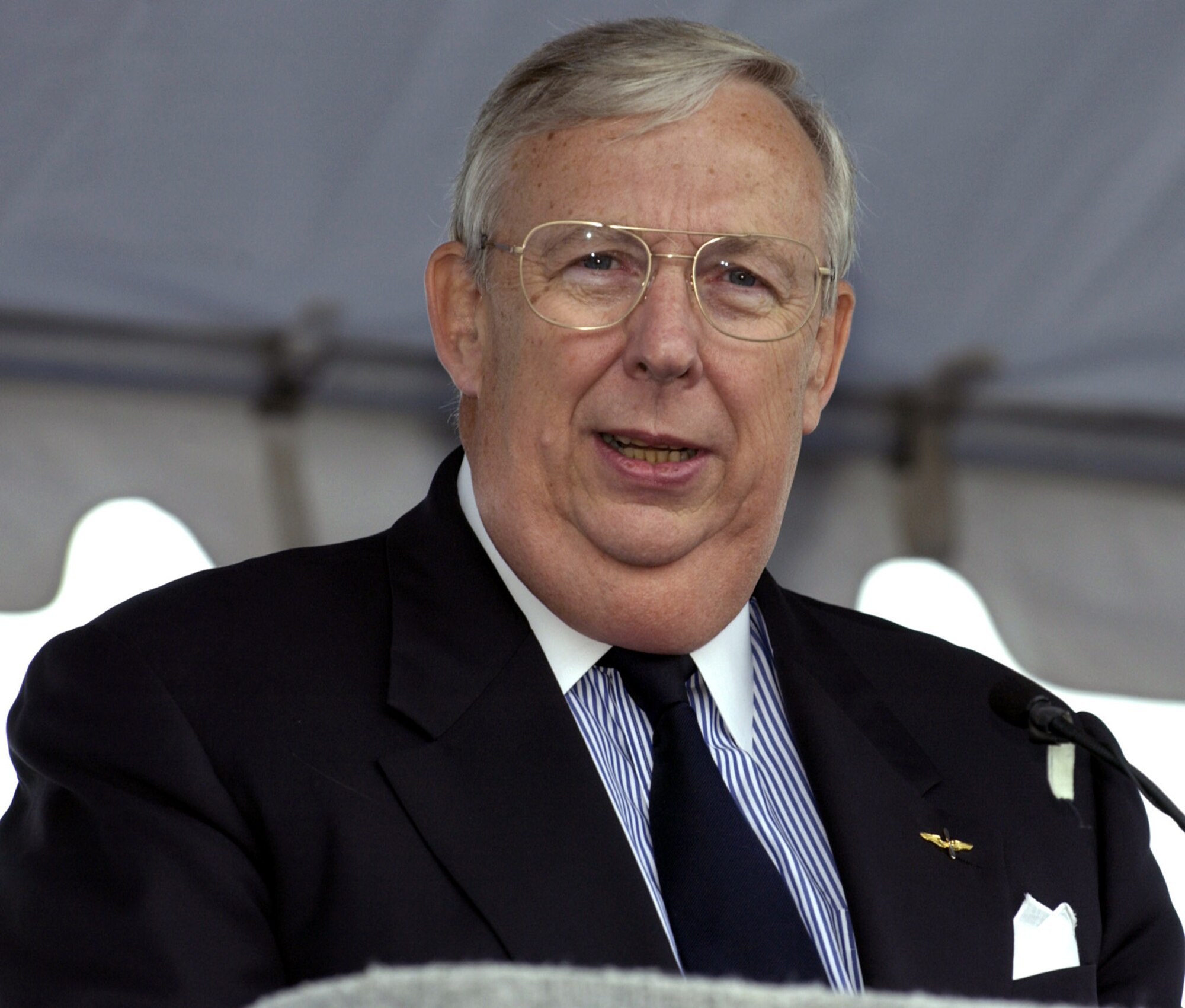 ARLINGTON, Va. -- Secretary of the Air Force Dr. James G. Roche addresses hundreds of people gathered for the official groundbreaking and site dedication ceremony on the site of the future national Air Force Memorial on Sept. 15.  The 270-foot tall memorial is designed to honor all those who have served in the U.S. Air Force and its predecessor organizations.  (U.S. Air Force photo by Master Sgt. Jim Varhegyi)