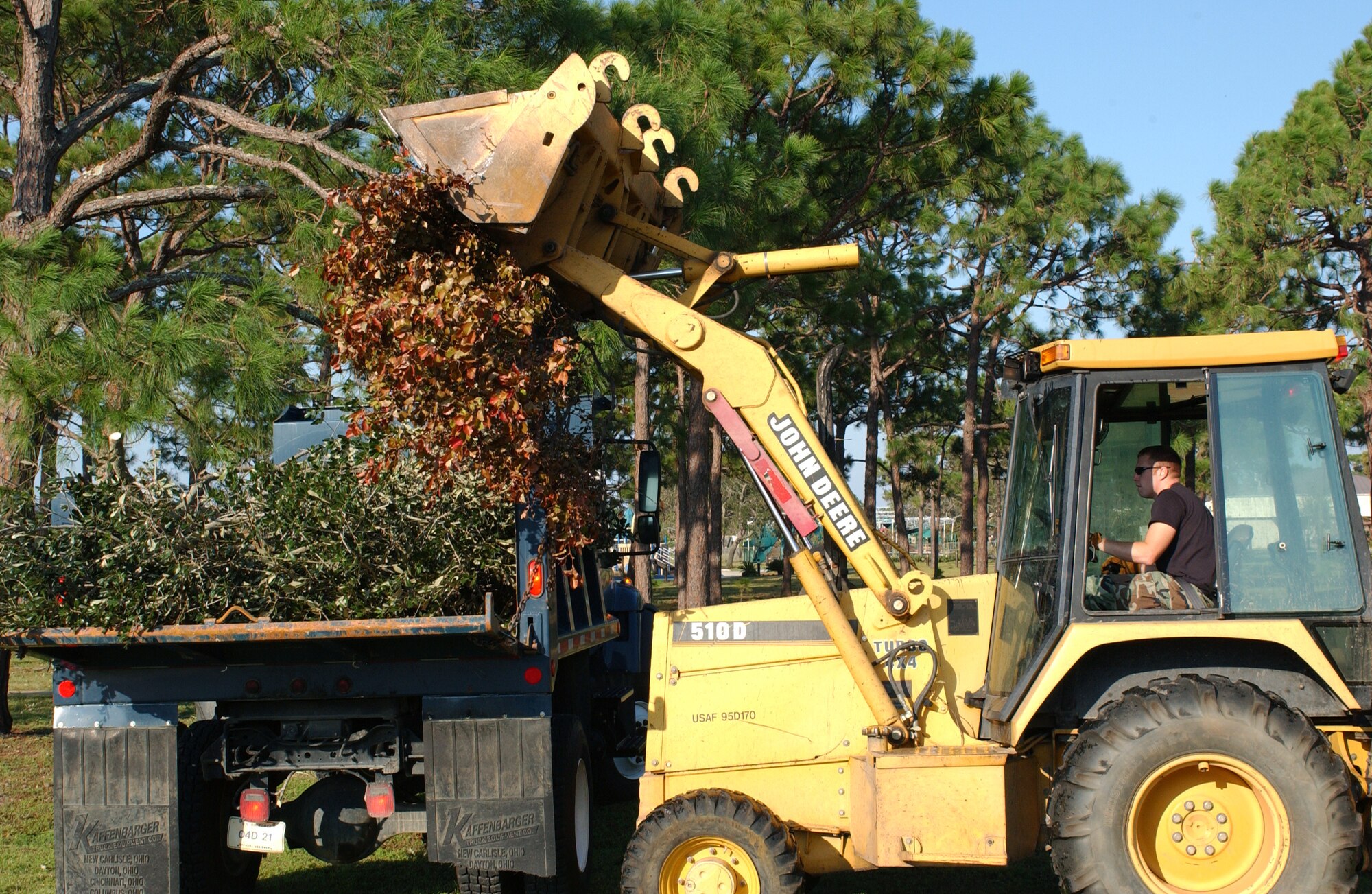 HURLBURT FIELD, Fla. -- A 16th Civil Engineer Squadron Airman cleans up debris Sept. 18 after Hurricane Ivan swept through the base two days earlier.  No one was injured, and base officials are still restoring operations.  (U.S. Air Force photo by Airman 1st Class Kimberly Gilligan)           