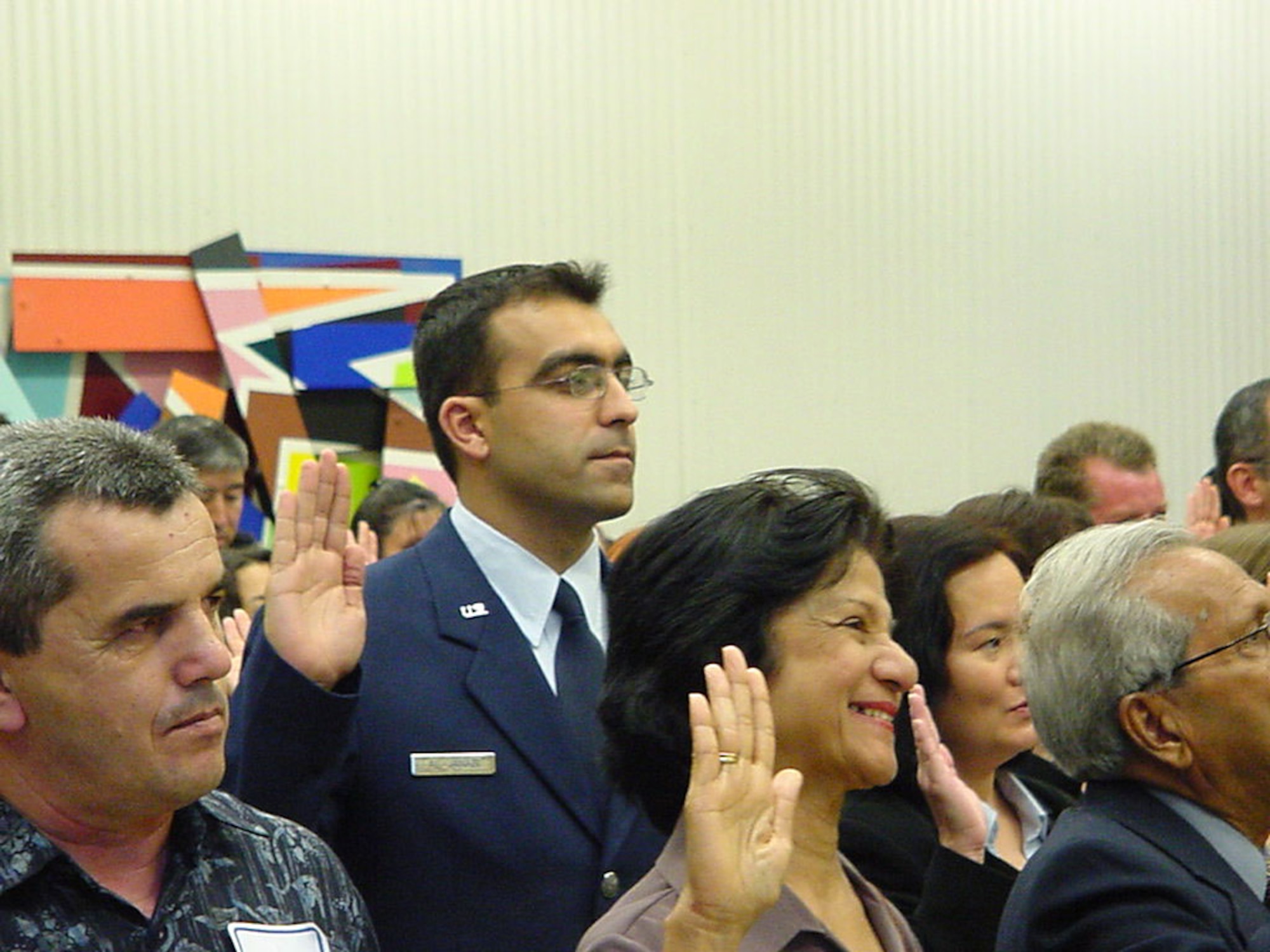 DAYTON, Ohio -- Airman 1st Class Mohammed Al Janabi swears in as a U.S. citizen during a ceremony held in the federal courthouse here Sept. 16.  He was born in Iraq and is a dental technician with the 74th Dental Squadron at nearby Wright-Patterson Air Force Base.  (U.S. Air Force photo by Al Eakle)