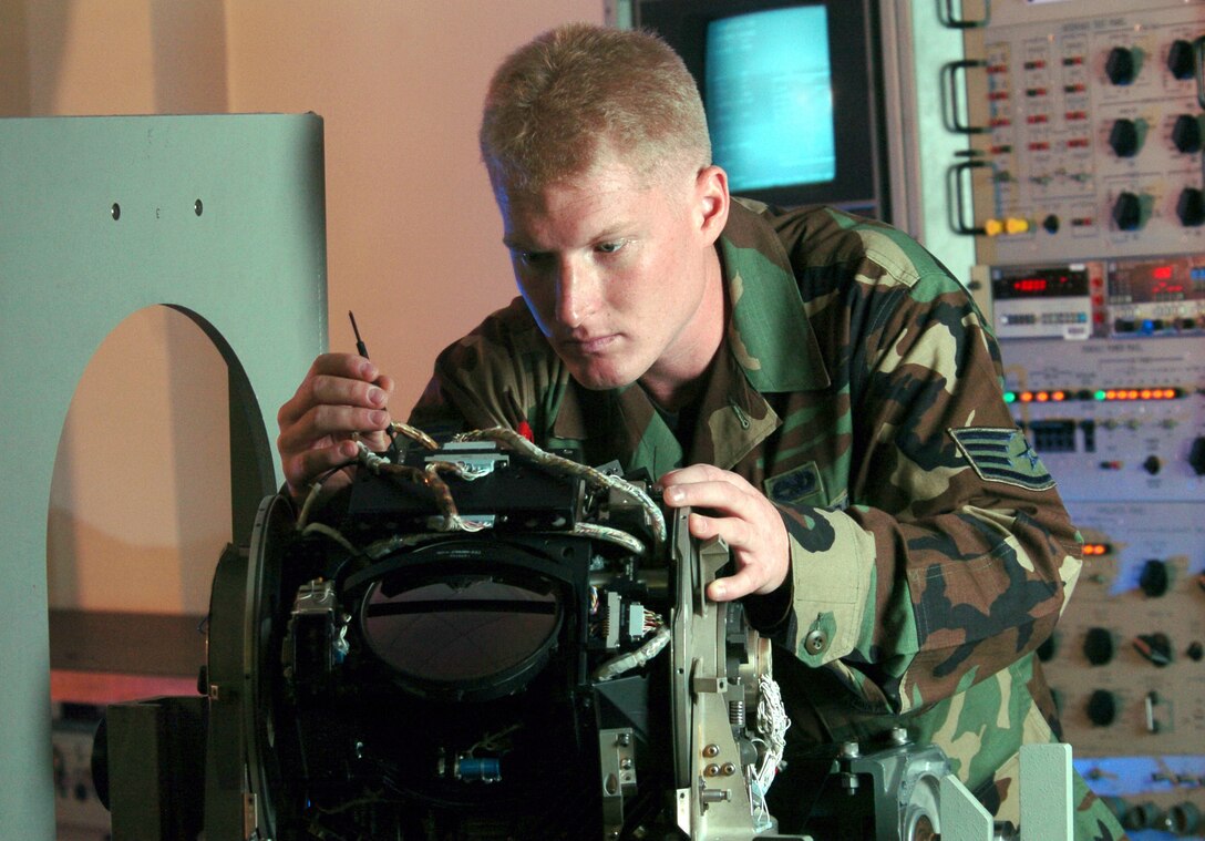 KADENA AIR BASE, Japan -- Staff Sgt. Ehren Wahl repairs an MC-130 infrared receiver during an inspection here.  The 353rd Maintenance Squadron Airmen provide maintenance for all MC-130 Combat Talons and Combat Shadows assigned to the 353rd Special Operations Group.  Sergeant Wahl is a communications navigation mission systems technician.  (U.S. Air Force photo by Master Sgt. Val Gempis)