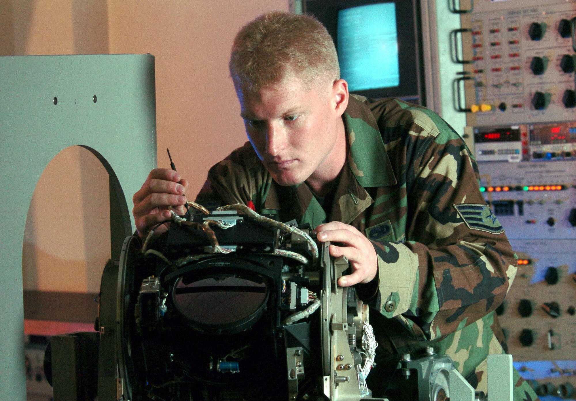 KADENA AIR BASE, Japan -- Staff Sgt. Ehren Wahl repairs an MC-130 infrared receiver during an inspection here.  The 353rd Maintenance Squadron Airmen provide maintenance for all MC-130 Combat Talons and Combat Shadows assigned to the 353rd Special Operations Group.  Sergeant Wahl is a communications navigation mission systems technician.  (U.S. Air Force photo by Master Sgt. Val Gempis)