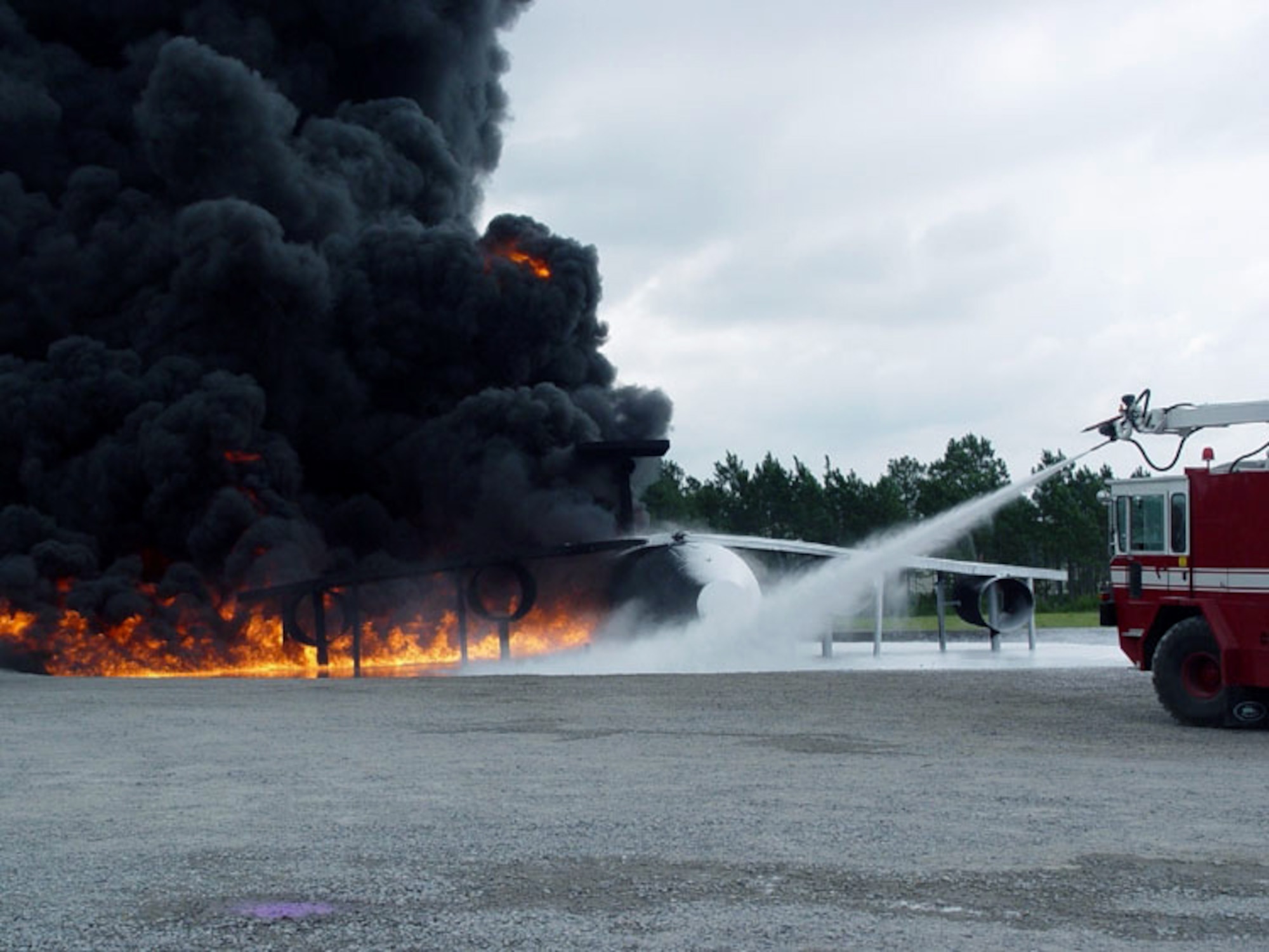 TYNDALL AIR FORCE BASE, Fla. -- Firefighters here train using a new method to extinguish fires.  The new method, developed by the Air Force Research Laboratory's deployed base systems branch, combines high pressures with water and aqueous film-forming foam.  (U.S. Air Force photo by 2nd Lt. William Powell)