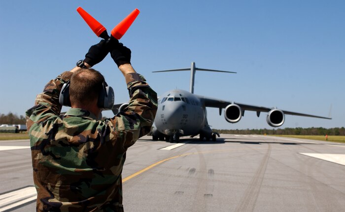 CHARLESTON AIR FORCE BASE, S.C. -- First Lt. Michael Thompson taxies a C-17 Globemaster from here Sept. 19. The C-17 is loaded with Meals-Ready-to-Eat that will be handed out to the local community affected by Hurricane Ivan at a high school in Pensacola, Fla.  Lieutenant Thompson is assigned to the 821st Air Mobility Squadron, McGuire Air Force Base, N.J.  (U.S. Air Force photo by Staff Sgt. Sarayuth Pinthong) 