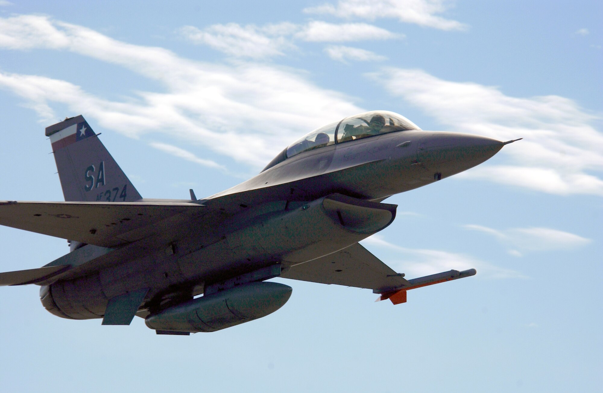 LASK AIR BASE, Poland -- An F-16 Fighting Falcon returns here after flying a familiarization flight Sept. 14.  The Texas Air National Guard's 182nd Fighter Squadron is here to familiarize members of the Polish Air Force with the F-16 capabilities along with its day-to-day operations and maintenance. The squadron is from Lackland Air Force Base, Texas.  (U.S. Air Force photo by Tech. Sgt. Justin D. Pyle)                   