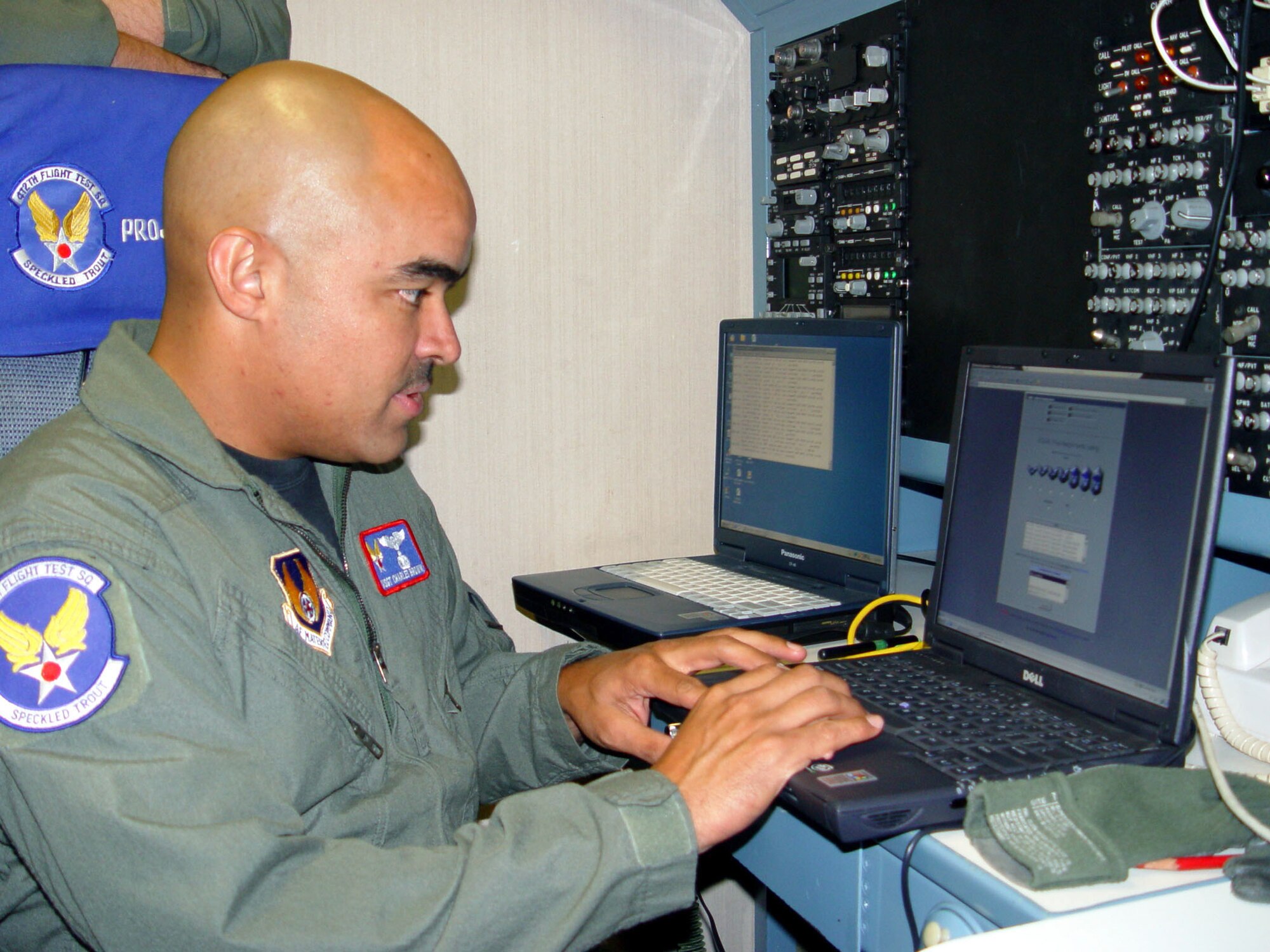 EDWARDS AIR FORCE BASE, Calif. -- Master Sgt. Charles Brown tests the operational use of airborne Internet access during a test flight on a C-135 Speckled Trout.  He is assigned to the 412th Flight Test Squadron here.  (U.S. Air Force photo by Capt. Julie Elenbaum)