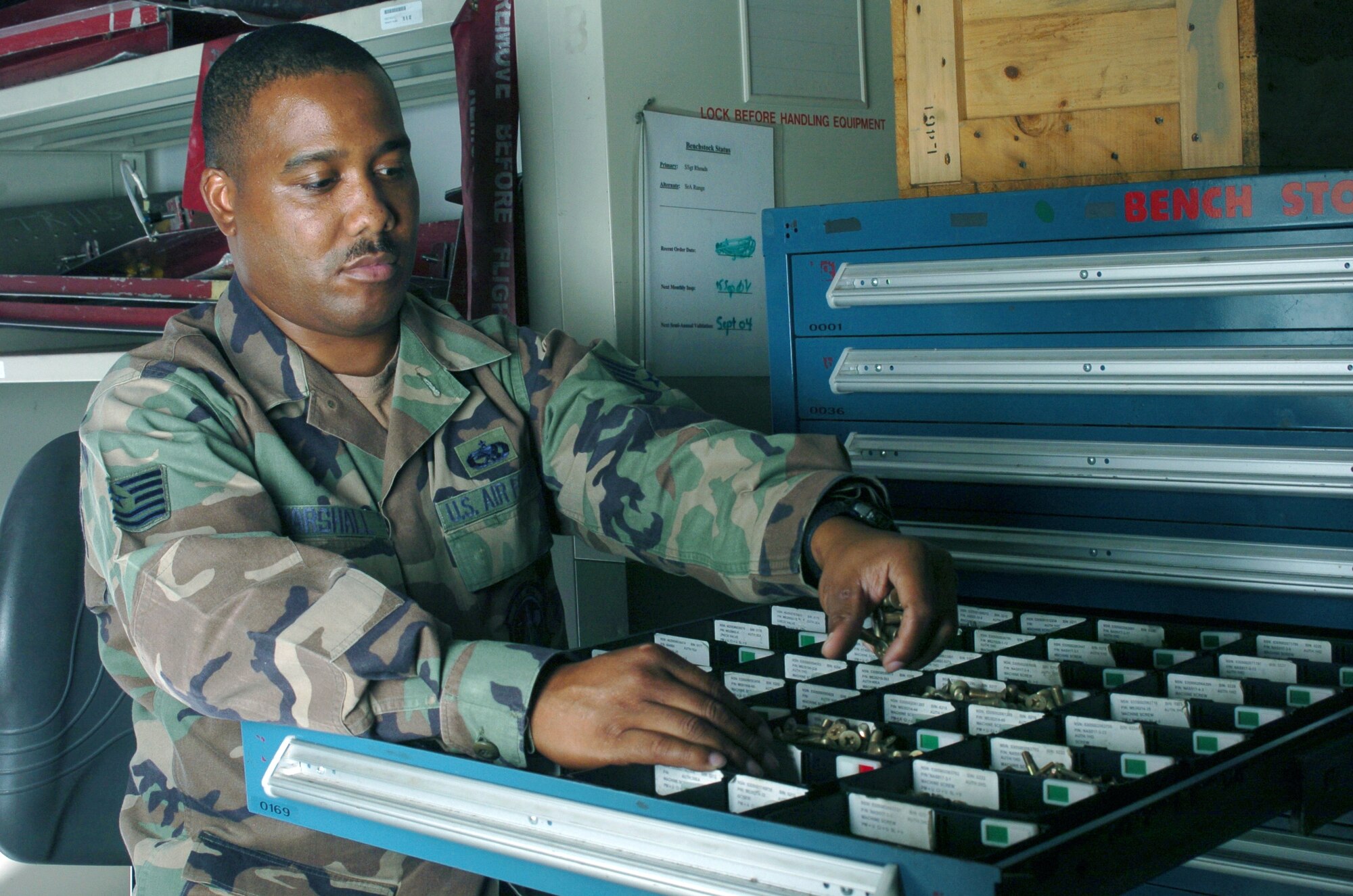 KADENA AIR BASE, Japan -- Tech. Sgt. Kenneth Marshall sorts bolts in a bench-stock drawer at the consolidated tool kit section.  The tool kit Airmen handle about 1,600 bench-stock items, about 200 pieces of equipment and 120 hazardous materials for mechanics who maintain the Special Operations MC-130 Combat Talon and Combat Shadow fleet here.  Sergeant Marshall is assigned to the 353rd Maintenance Squadron.  (U.S. Air Force photo by Master Sgt. Val Gempis)