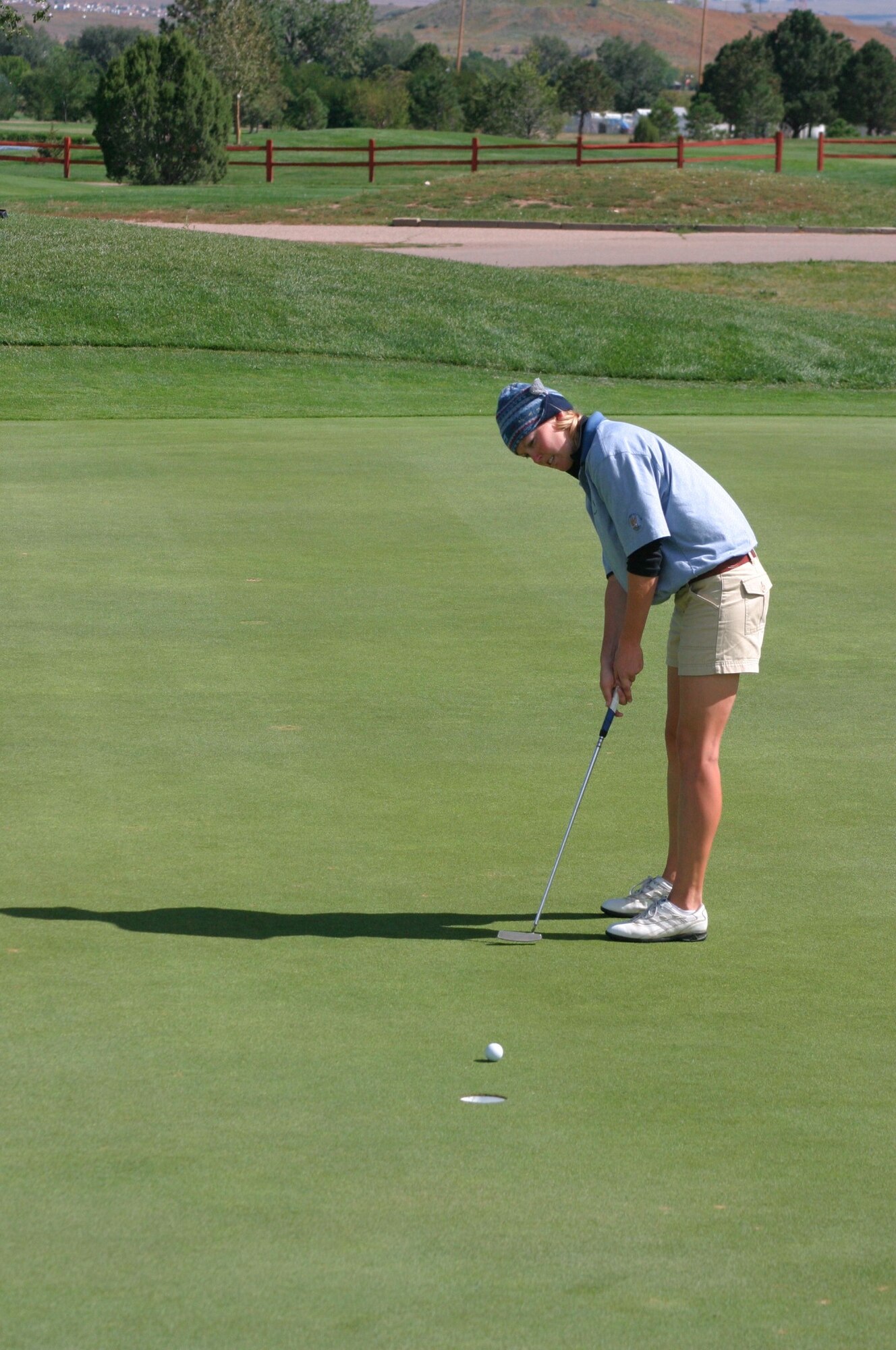 FORT CARSON, Colo -- Karin Tjelmeland putts during the 2004 Armed Forces Golf Championship here.  The Air Force golf team won the four-day match.  Tjelmeland was the top female golfer with her total of 341.  She is from Lajes Field, Azores.  (U.S. Air Force photo by Steve Brown)