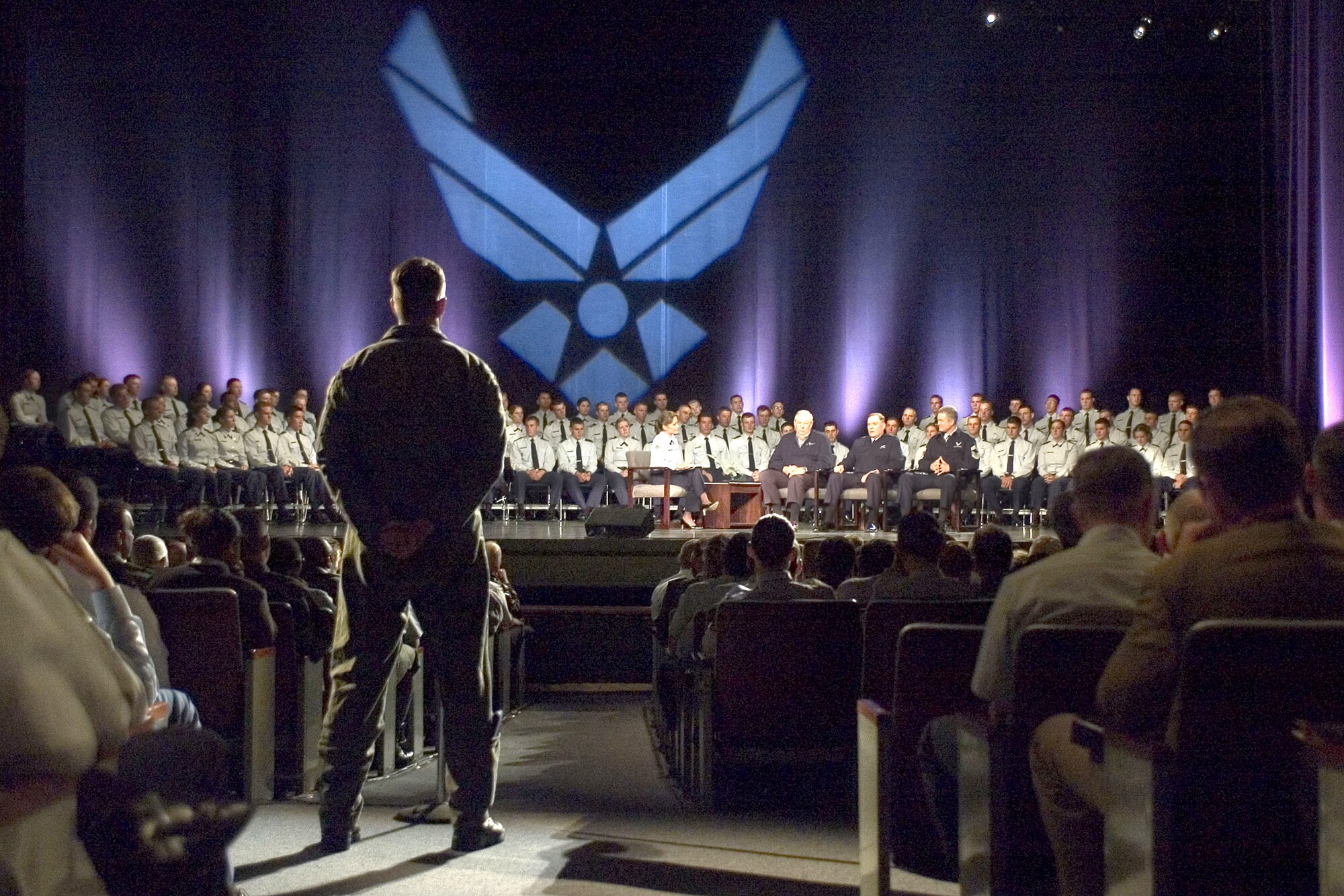 U.S. AIR FORCE ACADEMY, Colo. -- An Airman asks a question to the Air Force's top three leaders -- Secretary of the Air Force Dr. James G. Roche, Air Force Chief of Staff Gen. John P. Jumper and Chief Master Sgt. of the Air Force Gerald R. Murray -- during the town hall meeting here Sept. 27.  The event was broadcast on The Pentagon Channel and American Forces Radio and Television Service stations worldwide.  (U.S. Air Force photo by Charley Starr)