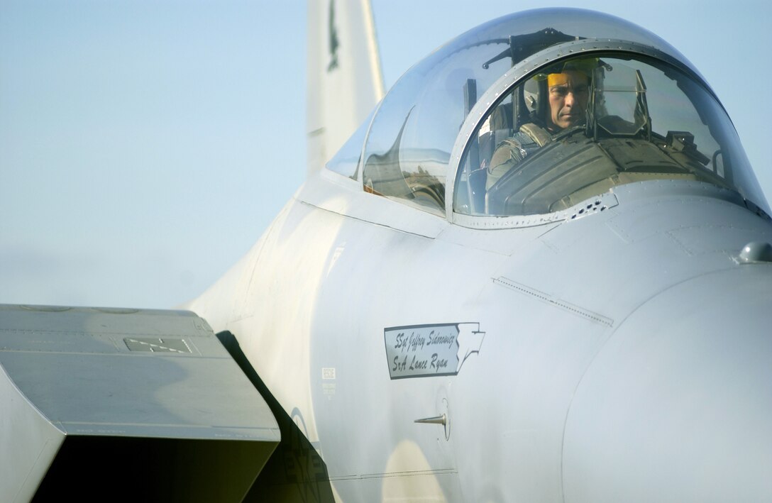 LANGLEY AIR FORCE BASE, Va. -- Lt. Col. Stuart Nichols prepares to fly an F-15 Eagle's final mission in the 27th Fighter Squadron.  After Oct. 1, the unit will officially begin the migration to become the first operational F/A-22 Raptor squadron by mid-2005.  Colonel Nichols is the squadron's commander.  (U.S. Air Force photo by Tech. Sgt. Ben Bloker)