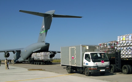 MANAS AIR BASE, Kyrgyz Republic -- Trucks line up as Operation Provide Hope aid is unloaded from a C-17 Globemaster III from McChord Air Force Base, Wash., on Sept. 23.  More than $15 million worth of medicines and medical supplies were flown in.  (U.S. Air Force photo by Staff Sgt. Chuck Marsh)