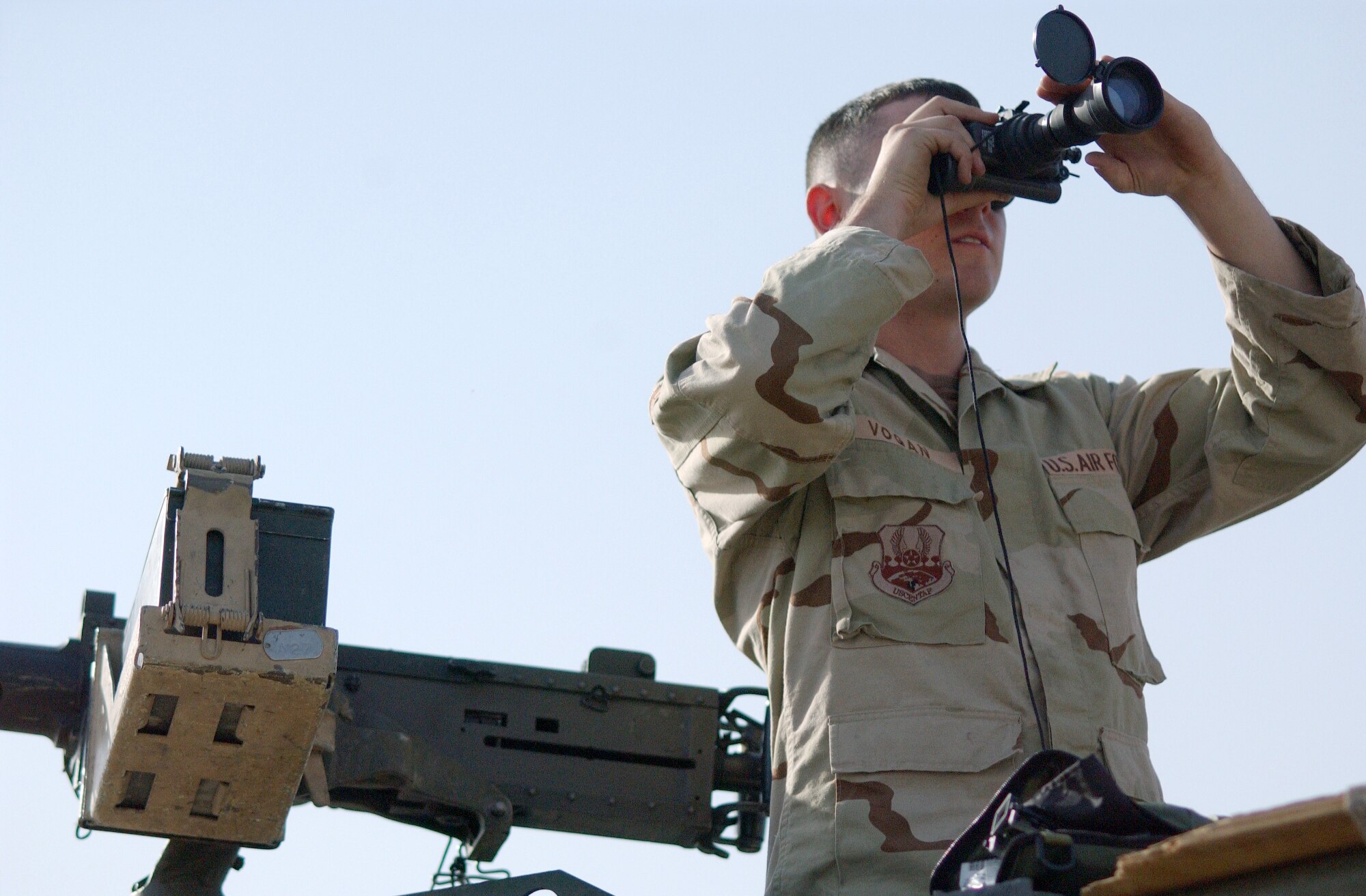 MOSUL, Iraq -- Airman 1st Class Adam Vogan inspects night-vision goggles before a convoy escort mission Sept. 22.  Airman Vogan is a vehicle operator for Detachment 1 of the 732nd Expeditionary Logistics Readiness Squadron here.  He is deployed from Eglin Air Force Base, Fla.  (U.S. Air Force photo by Staff Sgt. Marc Barnes)