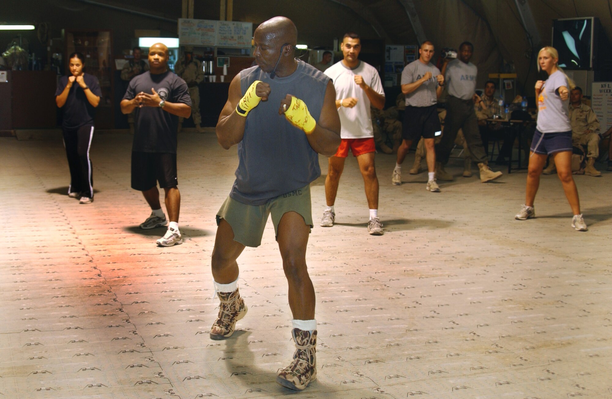 KIRKUK AIR BASE, Iraq -- Billy Blanks leads a Tae Bo training session for people stationed here Sept. 28. Blanks was touring different bases throughout Iraq signing autographs and performing Tae Bo sessions for troops deployed here. (U.S. Air Force photo by Staff Sgt. Adrian Cadiz) 