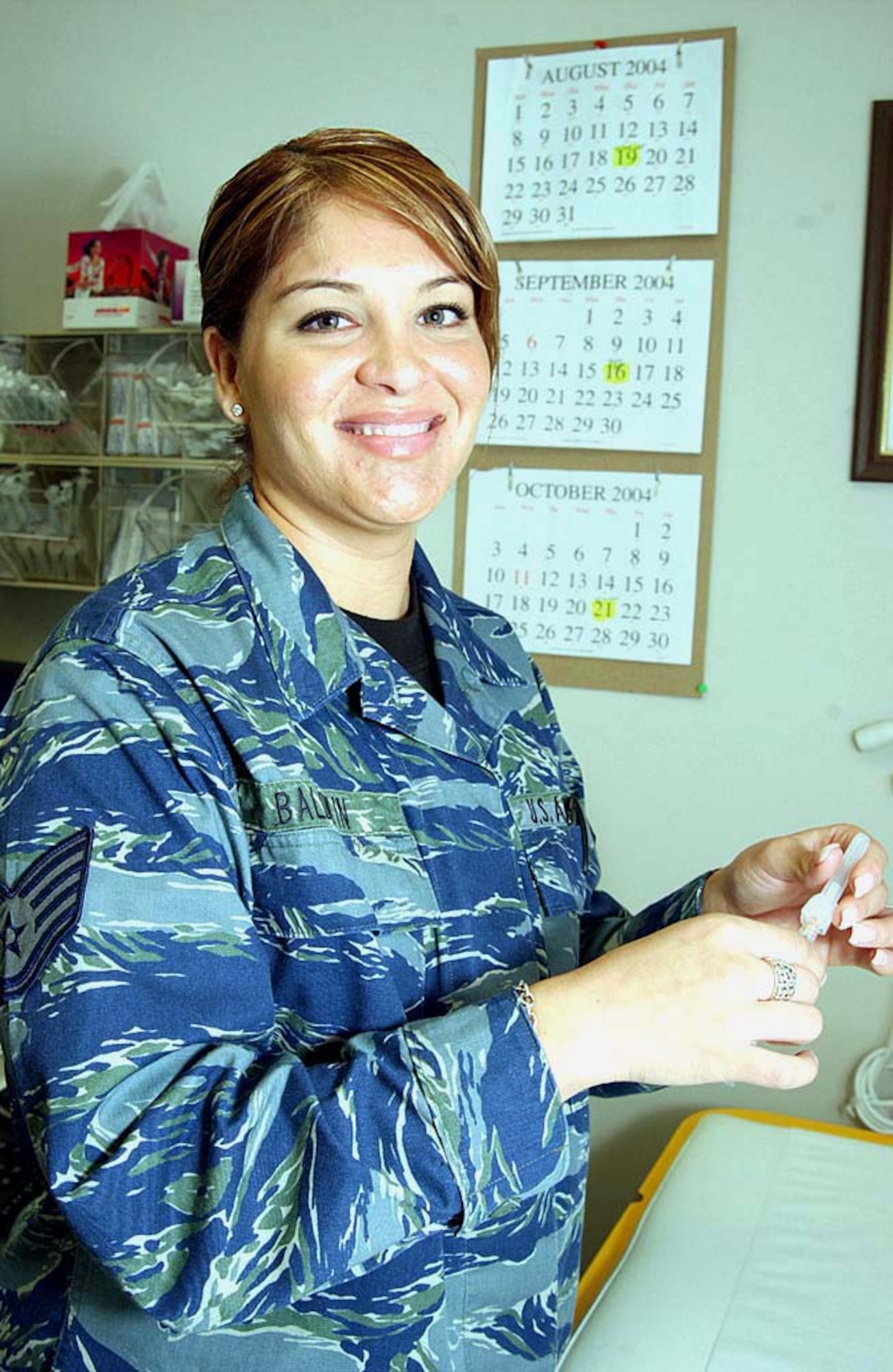 MOODY AIR FORCE BASE, Ga. -- Staff Sgt. Georgina Baldwin, wearing the proposed utility uniform, said she takes pride in knowing that she is part of the team that takes care of the active-duty Airmen defending America.  She is an allergy and immunization technician with the 347th Medical Operations Squadron here.  (U.S. Air Force photo by Staff Sgt. Manuel Martinez)