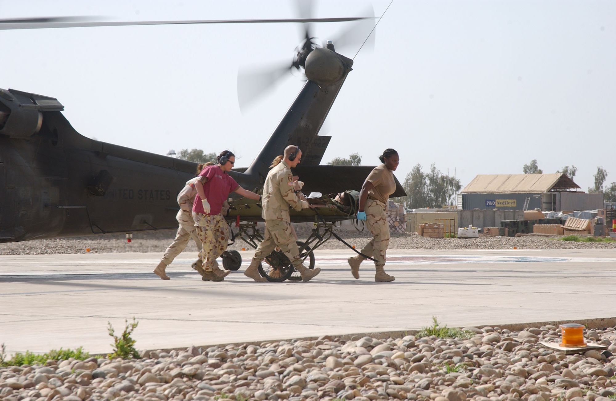 BALAD AIR BASE, Iraq -- A medical evacuation team moves a wounded Soldier to the emergency room at the Air Force theater hospital here.  Airmen of the 332nd Expeditionary Medical Group run the hospital that serves as a primary care clinic and a contingency aero medical staging facility used to provide medical services for U.S. and coalition forces.