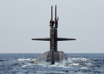 The submarine USS Albuquerque (SSN 706) departs Souda harbor in Crete, Greece, after a port visit on March 25, 2005. The Los Angeles-class fast attack submarine is home ported in Groton, Conn., and is deployed with the USS Harry S. Truman Carrier Strike Group in support of the war on terror. 